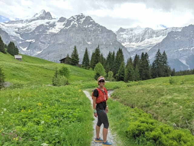 Lucarelli Wellness, owner standing on path in front of Swiss Alps